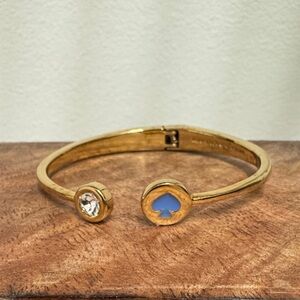 Kate Spade Vintage Gold-Tone Open Cuff Bracelet with Blue Spade Accent